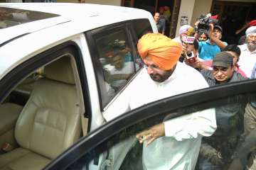 Congress leader Navjot Singh Sidhu leaves the residence of former MLA Lal Singh after a meeting, in Patiala, Thursday, May 19, 2022. The SC imposed a sentence of one-year rigorous imprisonment on cricketer-turned-politician Navjot Singh Sidhu in a 1988 road rage case.