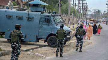 Security personnel patrol to maintain law and order, in Srinagar, Tuesday, May 3, 2022.