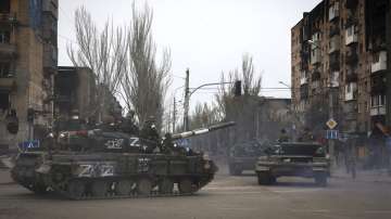 Russian military vehicles move in an area controlled by Russian-backed separatist forces in Mariupol, Ukraine, Saturday, April 23, 2022. 