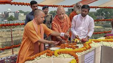 Uttar Pradesh CM Yogi Adityanath lays the foundation stone of the sanctum sanctorum of the Ram temple, in Ayodhya.