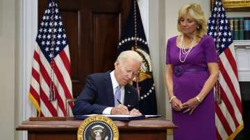 President Joe Biden signs into law S. 2938, the Bipartisan Safer Communities Act gun safety bill, in the Roosevelt Room of the White House in Washington
