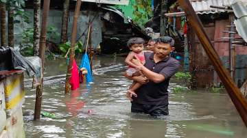 SDRF members carry out rescue work in a flood-hit locality in Bongaigaon town. The total death toll from Assam rains has touched 44.?