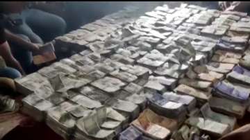 WATCH Bihar Drugs Inspector home raided pile of cash seized covers entire bed, latest news updates t