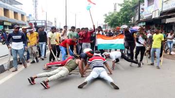 Dhanbad: People block a road to protest against Centres Agnipath scheme, the new Armed Forces recruitment scheme in Dhanbad on Saturday, June 18.