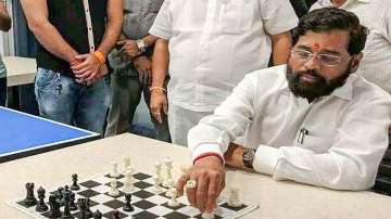 Rebel Shiv Sena leader Eknath Shinde plays chess at a hotel where he is staying with supporting MLAs, in Guwahati.