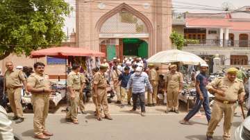 Muslim devotees come out of a mosque after offering Friday prayers, amid elaborate security arrangements in Ghaziabad.