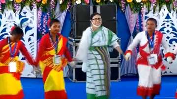 Bengal CM Mamata Banerjee dances with tribal women in Bengal's Alipurduar. 