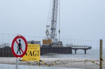 Construction work on a 200 meter long pier being built where the gas pipeline is due to come ashore at Houstrup Strand in West Jutland, Denmark. 