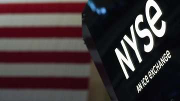 An NYSE sign is seen on the floor at the New York Stock Exchange in New York, Wednesday, June 15, 2022. 
