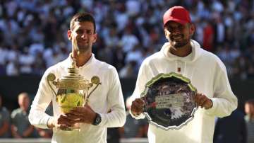 Novak Djokovic and Nick Kyrgios pose with their trophies 
