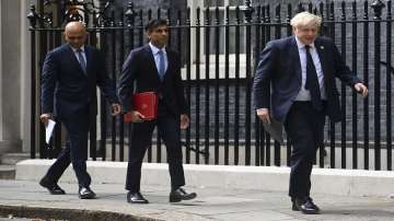 From left, British Health Secretary Sajid Javid, Chancellor of the Exchequer Rishi Sunak and Prime Minister Boris Johnson arrive at No 9 Downing Street.