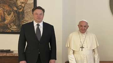 Tesla CEO Elon Musk (left) with Pope Francis (right).??
