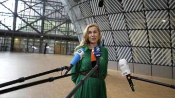 European Commissioner for Energy Kadri Simson speaks with the media as she arrives for an emergency meeting of EU energy ministers in Brussels on Tuesday, July 26, 2022. 