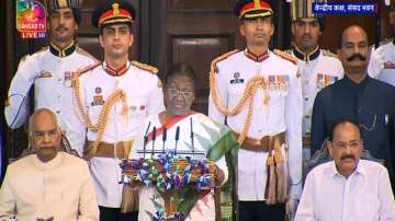 Image shows President Murmu taking oath at Parliament House 