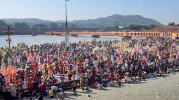 Kanwariyas (Lord Shiva devotees) at the Har Ki Pauri ghat on the first Somwar (Monday) of the holy month of Shravan, in Haridwar, Monday, July 18, 2022.