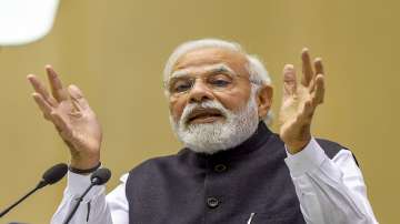 PM Narendra Modi with Senior Minister of Singapore Tharman Shanmugaratnam and Union Finance Minister Nirmala Sitharaman during the first 'Arun Jaitley Memorial Lecture', in New Delhi, Friday, July 8, 2022.