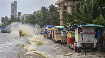 High tidal waves hit food stalls during the monsoon season at Dadar beach in Mumbai on Wednesday, July 13, 2022.