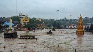 Nashik: Temples submerged in floodwater after a rise in the water level of the Godavari river following the release of water from the Gangapur Dam, which supplies drinking water to the city, and monsoon rains in Nashik, Monday, July 11, 2022.