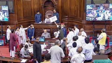 Opposition members protest in the Rajya Sabha during ongoing Monsoon Session of Parliament, in New Delhi.