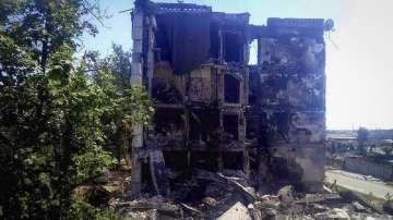 In this photo provided by the Luhansk region military administration, damaged residential buildings are seen in Lysychansk, Luhansk region, Ukraine, early Sunday, July 3, 2022.?