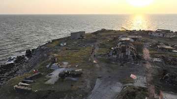 Ukrainian soldiers install the state flag on Snake island, in the Black Sea. The Ukrainian military returned with Ukraine flag to the island, which had been under the control of Russian troops for some time.