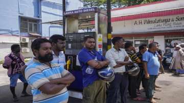 People wait to buy fuel at a fuel station in Colombo, Sri Lanka, June 27, 2022.?