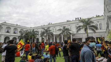 Protesters gather inside the premises of Sri Lankan presidents official residence in Colombo, Sri Lanka, Saturday, July 9, 2022. 