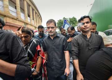 Congress leader Rahul Gandhi, wearing black clothes, along with party MPs marches towards Rashtrapati Bhawan as part of party’s nationwide protest over price rise, unemployment and GST hike on essential items, in New Delhi,