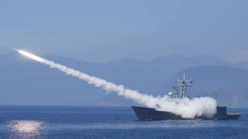 A Cheng Kung class frigate fires an anti air missile as part of a navy demonstration in Taiwan's annual Han Kuang exercises off the island's eastern coast near the city of Yilan, Taiwan on July 26, 2022. Taiwan has put its military on alert and staged civil defense drills.