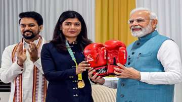 Prime Minister Narendra Modi with boxer Nikhat Zareen during the felicitation ceremony of the Indian contingent for the Commonwealth Games 2022, in New Delhi, Saturday, Aug. 13, 2022.