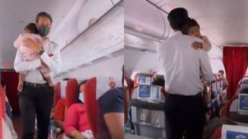 Air India's cabin crew calming down little baby girl