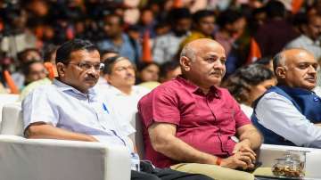 Delhi Chief Minister Arvind Kejriwal and Deputy CM Manish Sisodia (Centre).