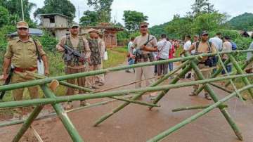 Assam Police stand vigil at Umlaper, a border village claimed by both Meghalaya and Assam, near West Karbi Anglong.