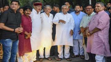 Janata Dal (United) leader Nitish Kumar with Rashtriya Janata Dal leader Tejashwi Yadav and others during a press conference, in Patna, Tuesday, Aug. 9, 2022.