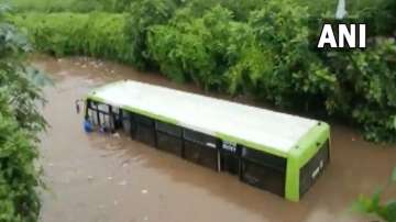 State bus sinks in waterlogged underpass in Khaorda while the public helped in the rescue operations. 