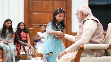 Raksha Bandhan 2022, PM Modi celebrates Raksha Bandhan with daughters of PMO staff, pm modi image, p
