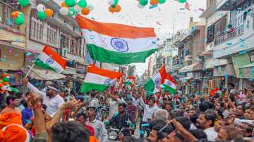  People holding the national flag participate in a 'Tiranga Yatra', organized as part of 'Azadi Ka Amrit Mahotsav' celebrations to commemorate the 75th anniversary of India’s independence.