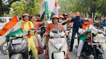 Union Minister Smriti Irani participates in the Tiranga Bike Rally