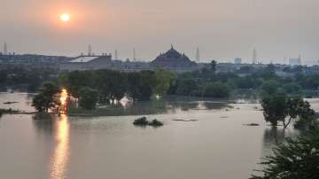 Swollen Yamuna river following Monsoon rains, in New Delhi, Saturday, Aug. 13, 2022. Evacuation of people from vulnerable areas intensified as the Yamuna river continued to flow above the danger mark in Delhi. 
