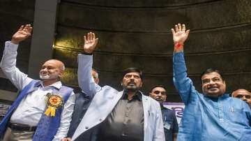 Union Minister for Social Justice and Empowerment Ramdas Athawale(C) with Union Minister of Road Transport and Highways of India Nitin Gadkari