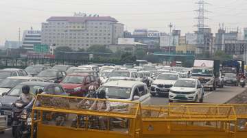 Vehicles ply on the Delhi-Gurugram Expressway at the Delhi-Gurugram border.