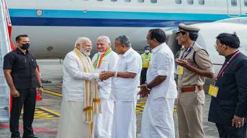 Prime Minister Narendra Modi being greeted by Kerala CM Pinarayi Vijayan and Governor Arif Mohammad Khan on his arrival at Kochi International Airport for his two-day visit to Kochi.