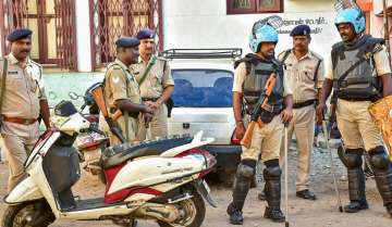 Madurai: Police personnel during a raid of National Investigation Agency (NIA) at the residence of a functionary of Popular Front of India (PFI), in Madurai, Thursday, Sept. 22, 2022. 