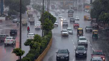 Vehicles ply on a road amid heavy rains, in Noida (Representational image)