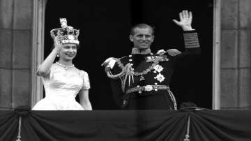 In this June. 2, 1953 file photo, Britain's Queen Elizabeth II and Prince Philip, Duke of Edinburgh wave to supporters from the balcony at Buckingham Palace, following her coronation at Westminster Abbey, London.