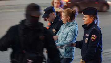 Police detain a demonstrator during a protest against mobilization in Yekaterinburg, Russia, Wednesday, Sept. 21, 2022.