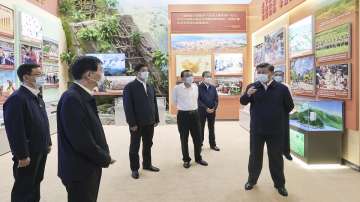 Chinese President Xi Jinping and other Chinese leaders visit the exhibition with the theme "Forging Ahead into the New Era" at the Beijing Exhibition Hall in Beijing