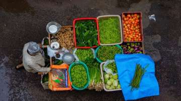 Vegetable vendor wears helmet to escape fine