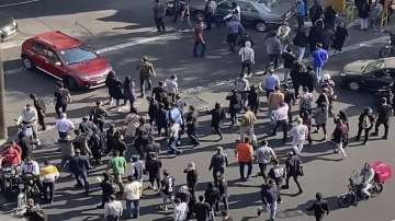 In this frame grab from video taken by an individual not employed by the Associated Press and obtained by the AP outside Iran shows people block an intersection during a protest. 