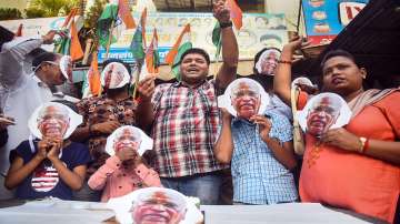 Congress workers celebrate after senior party leader Mallikarjun Kharge won the party's presidential election,